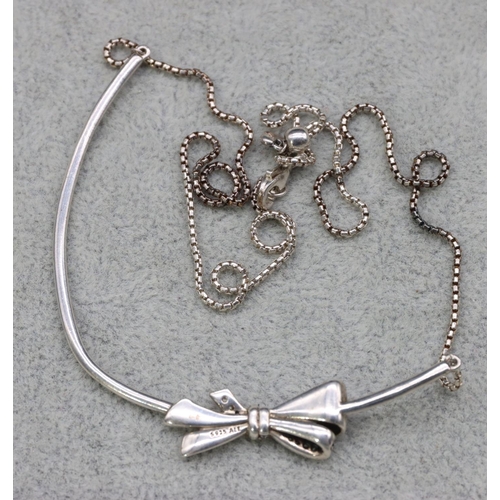 416 - A silver Pandora necklace with ribbon motif and square linked chain, 47.5cm long