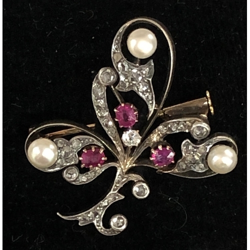 426 - An Asprey gold and silver spray brooch mounted with 3 rubies, 3 half pearls and rough cut diamonds, ... 