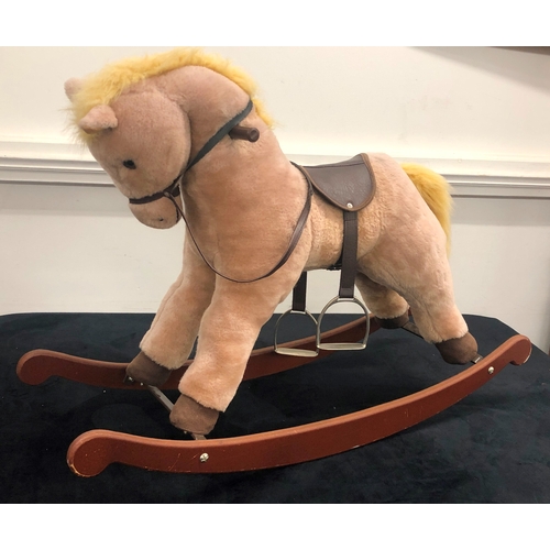 1011 - A Lefray Designs Ltd plush rocking horse on wood base, 65cm high overall.