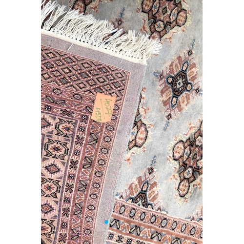 1016 - A modern Persian rug on cream and pale grey/blue ground, 188 x 277cm.