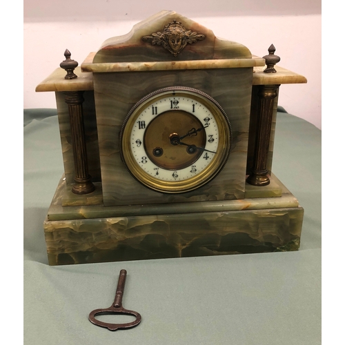 1025 - A green marble 8-day striking mantel clock with Arabic numerals (section of marble slightly loose to... 