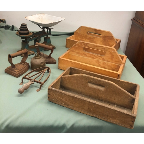 1039 - A set of old kitchen scales with weights, 3 wooden cutlery trays, 2 vintage box irons and 1 stand et... 