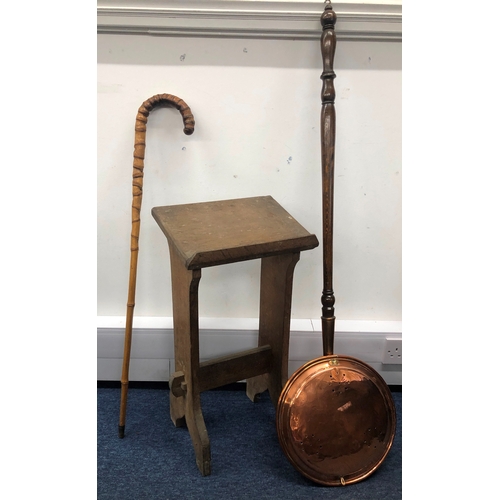 1040 - An oak prayer book stand, 63cm high, 35cm wide, 24cm deep, a copper bed warming pan and a bamboo wal... 