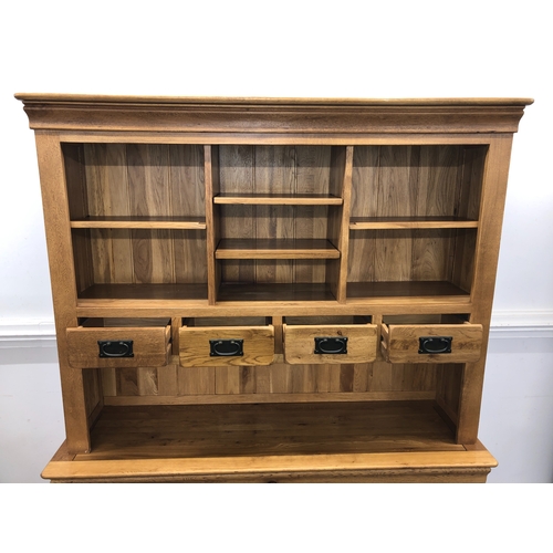 1067 - A JB Global oak dresser with 4 small upper drawers and open shelves, 3 lower drawers and 3 cupboard ... 