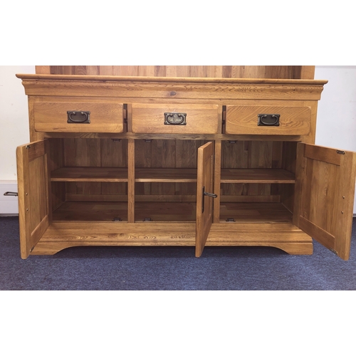 1067 - A JB Global oak dresser with 4 small upper drawers and open shelves, 3 lower drawers and 3 cupboard ... 