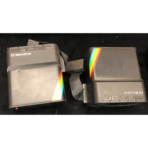 1082 - A Sinclair ZX Spectrum with a quantity of cables and cartridges, a Psion Series 5 pocket computer, a... 