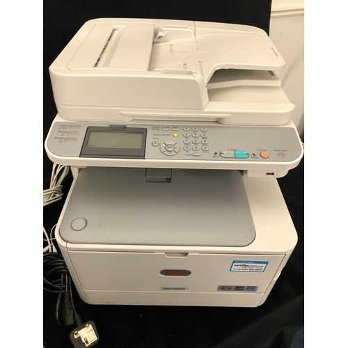 1092 - An Oki MC352 all in one printer and various printer cartridges (powers on).