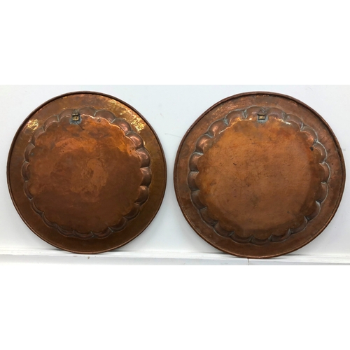 1127 - 2 large brass wall plates (non-matching), 55.5cm diameter