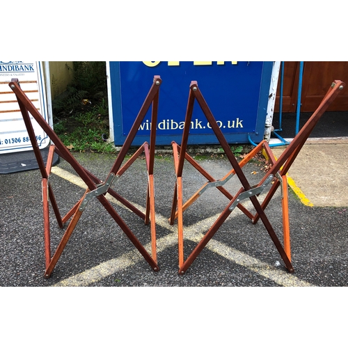 1130 - A pair of wooden framed folding chairs with canvas seat and matching canvas covers.