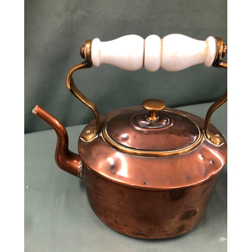 1142 - A lead cannon ball, a copper kettle with porcelain, handle, a brass pan cover, 6 plated teaspoons, 3... 