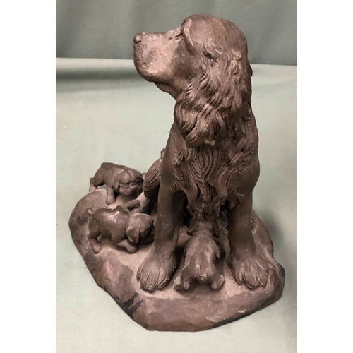 1149 - A resin figure of a Spaniel dog with 3 puppies, 18cm high