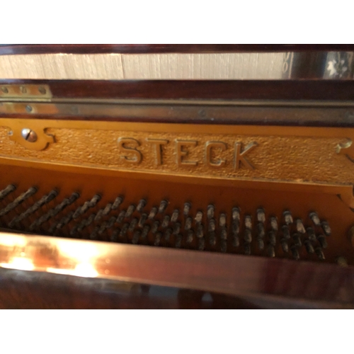 1159 - A Steck upright piano, 144cm wide, 64cm deep, 122cm high (light wear to veneer to top) and a piano s... 