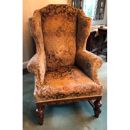 1166 - An oak framed upholstered wing back armchair, 80cm wide, 72cm deep, 117cm high. This item is not hel... 