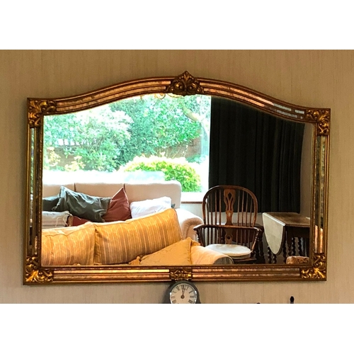 1169 - A Reproduction mirror with gilt and aged mirrored frame, 129cm wide, 87cm high. This item is not hel... 