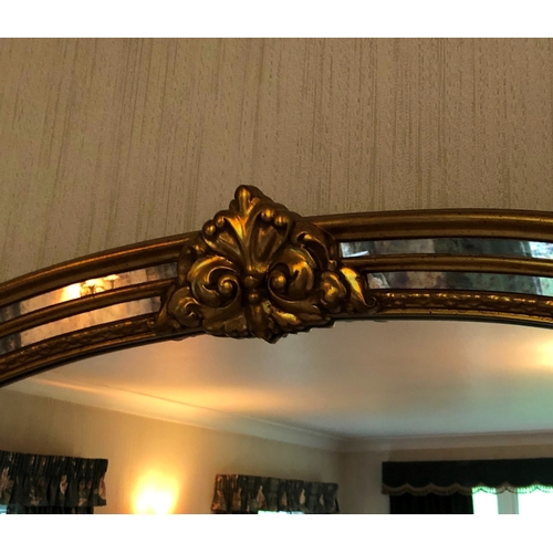 1169 - A Reproduction mirror with gilt and aged mirrored frame, 129cm wide, 87cm high. This item is not hel... 