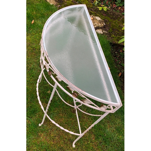 1183 - A semi-circular metal garden table with glass top, 75cm wide, 33cm deep, 73cm high. This item is not... 