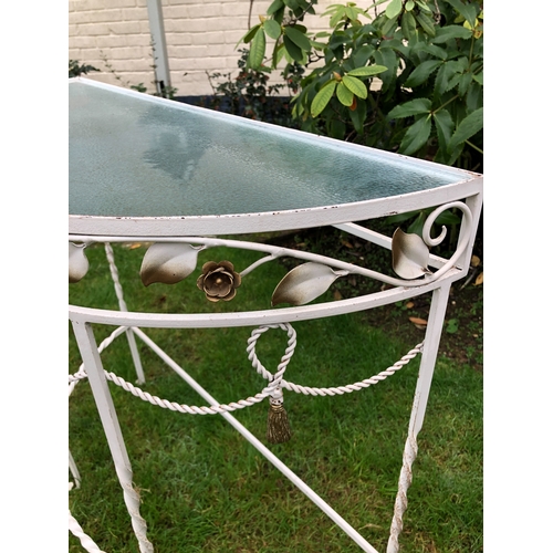 1183 - A semi-circular metal garden table with glass top, 75cm wide, 33cm deep, 73cm high. This item is not... 