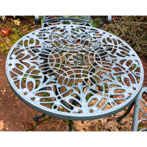 1188 - A green metallic circular garden table, 60cm diameter, 68cm high and 2 matching chairs. This item is... 