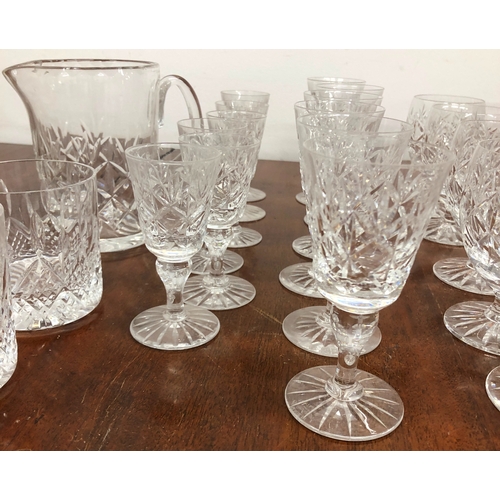 1197 - A set of crystal cut glasses, 6 glasses per size and 6 tumblers, 1 matching jug and 6 other tumblers... 