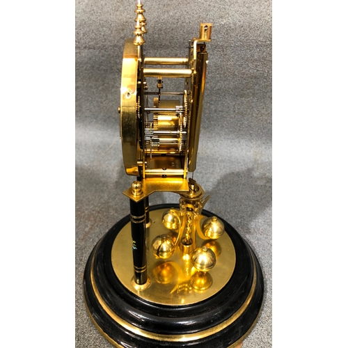 1201 - An anniversary clock with glass dome 30cm high overall.