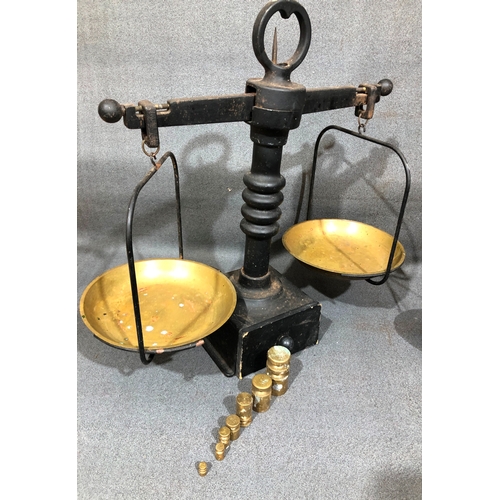 1207 - A set of brass scales, 58cm high overall (1 weight missing) and another set of wrought iron scales 4... 