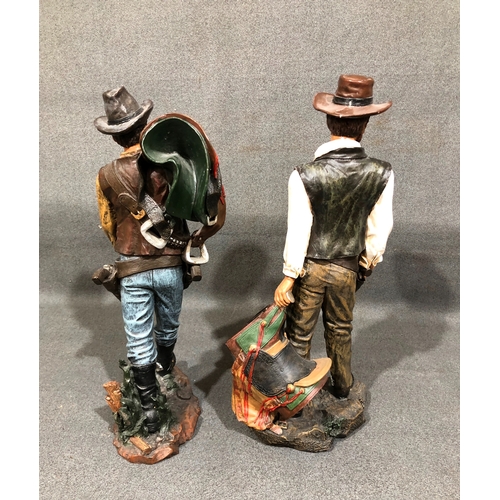 1210 - A pair of composition cowboy figures, tallest 48cm high.