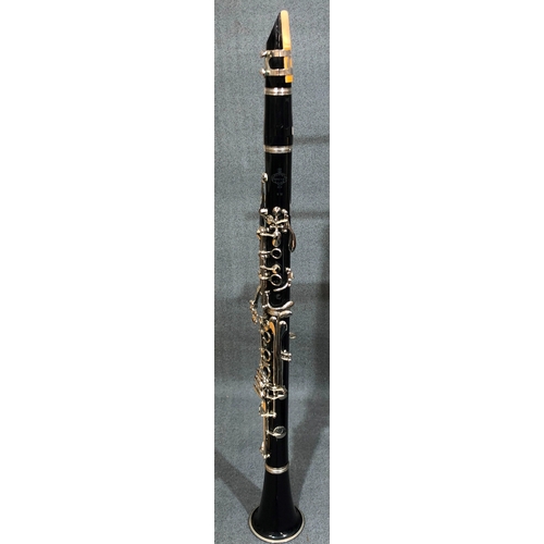 1215 - A Buffet Crampon Paris clarinet in hard case and a Stentor adjustable music stand