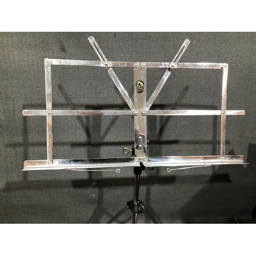 1215 - A Buffet Crampon Paris clarinet in hard case and a Stentor adjustable music stand