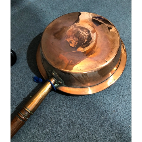 1218 - A vintage red bell telephone (RTT 56) and a brass warming pan, 116cm long.