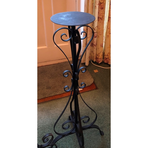 1225 - A black metallic floor lamp, 136cm high and a similar plant stand, 90cm high. This item is not held ... 