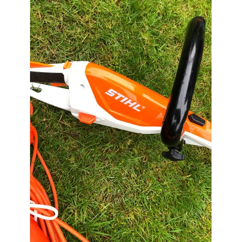 1239 - A Flymo Power Trim strimmer and a Stihl strimmer. This item is not held by PF Windibank, Collection ... 