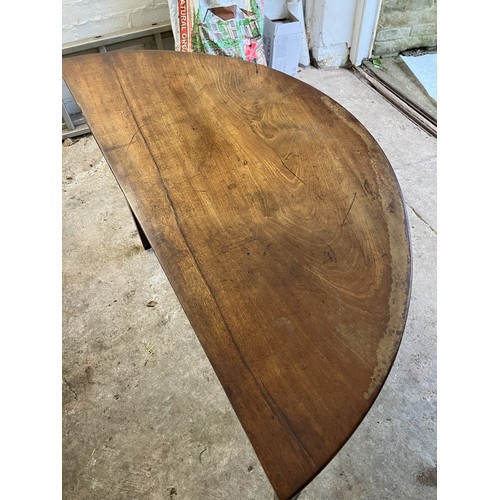 1259 - A demi lune mahogany table 105cm wide, 48cm deep, 71cm high (1 leg repaired and loose, water stain a... 