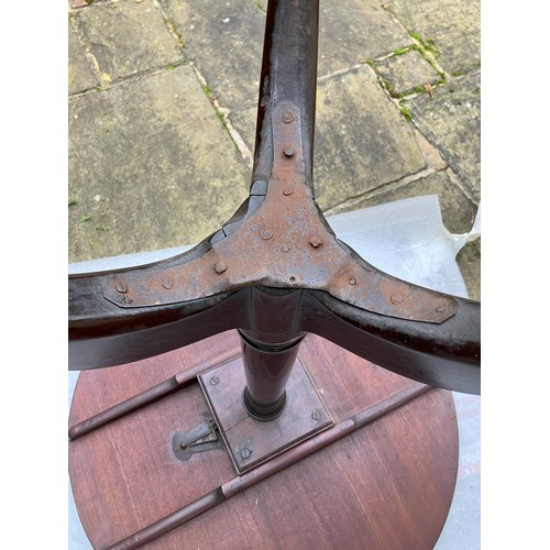 1260 - A mahogany circular occasional table, 70cm diameter, 70cm high (steel plate to leg support and small... 