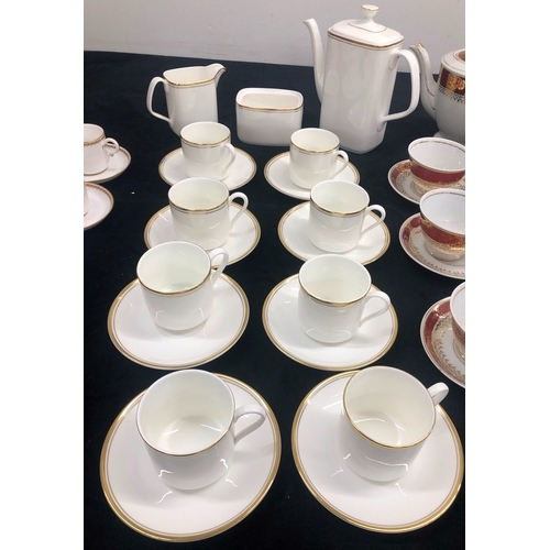 1005 - A Royal Worcester set of 8 coffee cups and 6 saucers, a Royal Doulton 