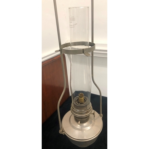 1008 - A pair of metallic hanging paraffin lamps converted to electricity, 64cm overall and another brass p... 