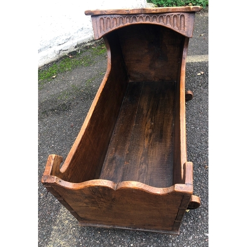 1013 - A good quality oak child's rocking cradle, 46.5cm wide, 102cm long, 53cm high overall.