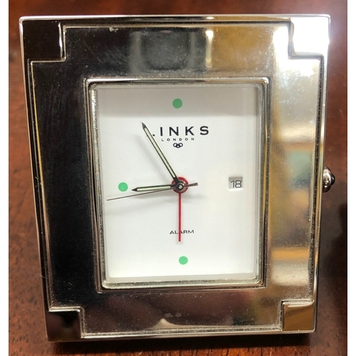 1015 - A Links of London rectangular Travel Alarm Clock 5.5 x 4.5cm, with leather case and a pair of opera ... 