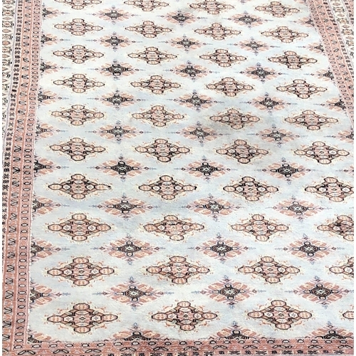 1016 - A modern Persian rug on cream and pale grey/blue ground, 188 x 277cm.