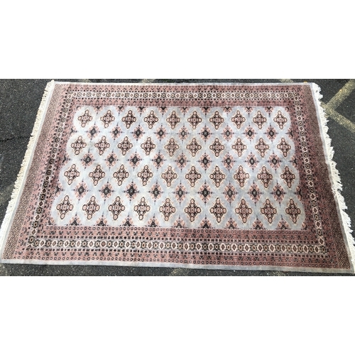 1016 - A modern Persian rug on cream and pale grey/blue ground, 188 x 277cm.