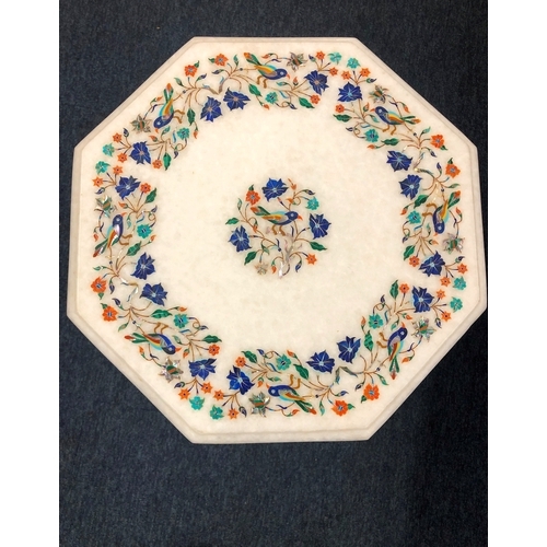 1033 - An inlaid white marble octagonal table with inlaid semi-precious stones in bird and floral pattern, ... 