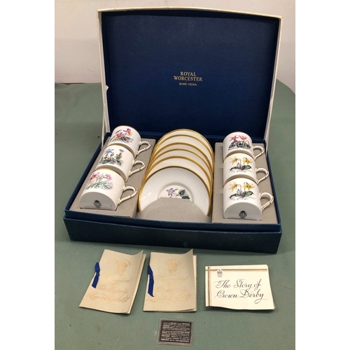 1034 - A Royal Worcester Bone China boxed coffee set, 6 cups, 6 saucers with floral patterns and gilt edgin... 