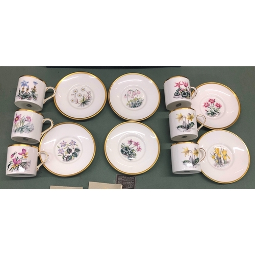 1034 - A Royal Worcester Bone China boxed coffee set, 6 cups, 6 saucers with floral patterns and gilt edgin... 