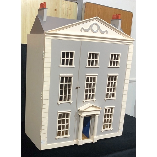 1054 - A large, good quality 3 storey dolls house with hinged opening front and decorated interior, 89cm hi... 