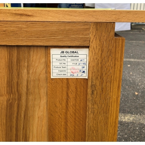 1057 - JB Global light oak sideboard with 4 drawers, 2 panel doors enclosing 1 adjustable shelf to each sid... 