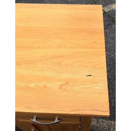 1062 - A JB Global light oak desk with 5 drawers, 1 cupboard door (no shelf), cable hole to back panel, 140... 