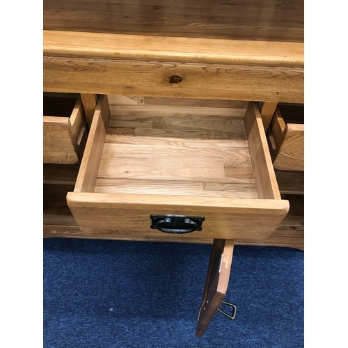 1067 - A JB Global oak dresser with 4 small upper drawers and open shelves, 3 lower drawers and 3 cupboard ... 