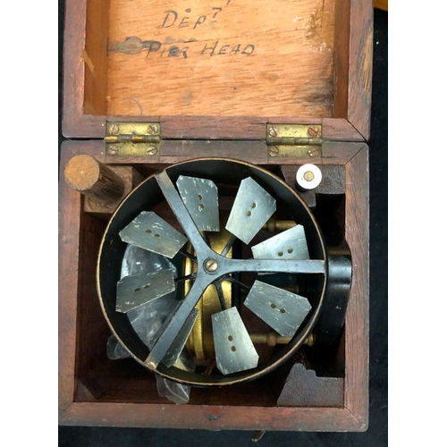 1080 - A brass J Casartelli full circle brass protractor in wood case, a Zero Settings Air meter in wood ca... 