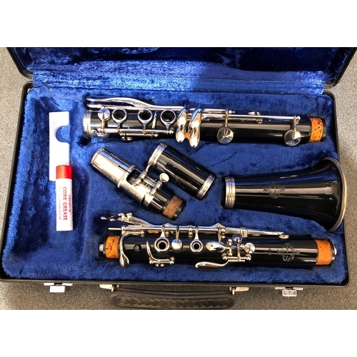 1215 - A Buffet Crampon Paris clarinet in hard case and a Stentor adjustable music stand