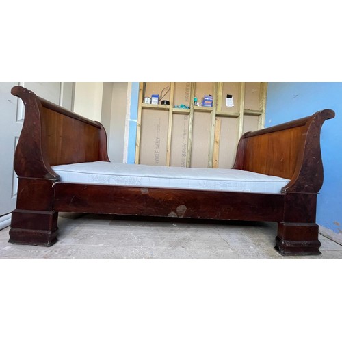 1295 - An Empire sleigh bed, 97cm wide, 200cm long overall, to fit a mattress 182cm x 82cm (some wear and m... 