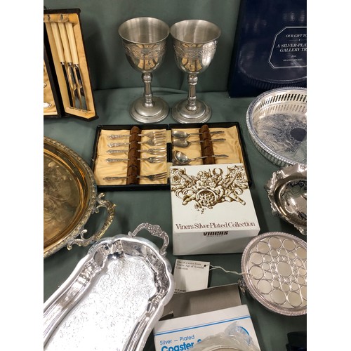 1312 - A quantity of various plated items, including a pair of goblets, coasters etc and a Hadson gas light... 